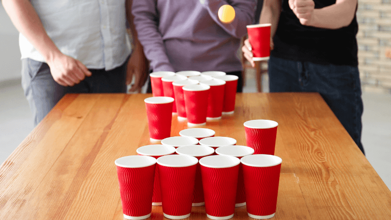 people playing beer pong game