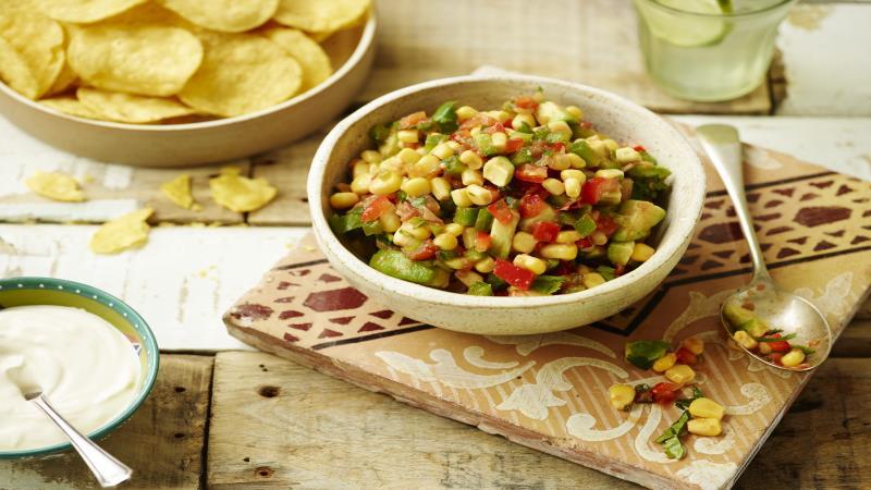 avocado corn salsa served in a white bowl