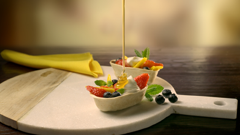 Stand N' Stuff Fruit tacos served on a white pan