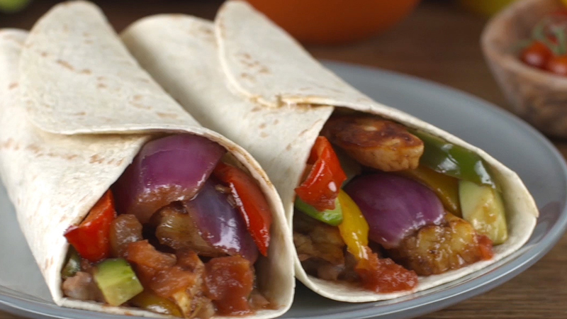 Old El Paso fajitas filled with roasted halloumi and vegetables