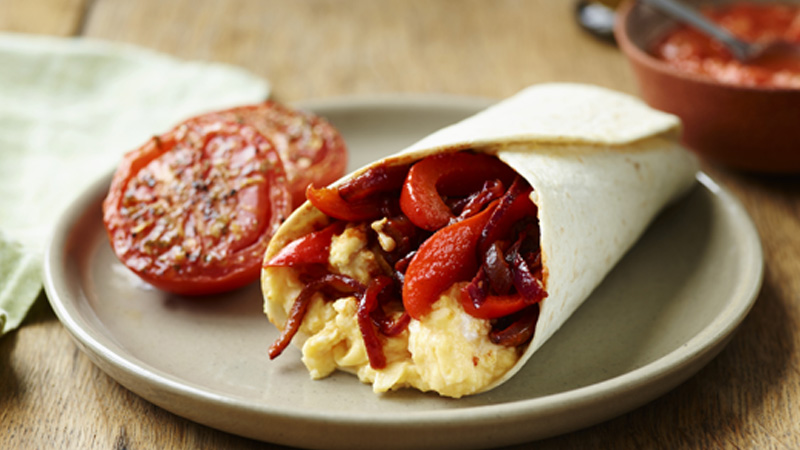 Vegetable Egg Fajitas served in a gray plate with roasted tomato
